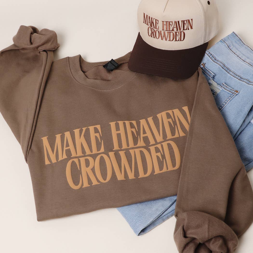 Brown sweatshirt with 'MAKE HEAVEN CROWDED' text, beige cap, and blue jeans on a white background