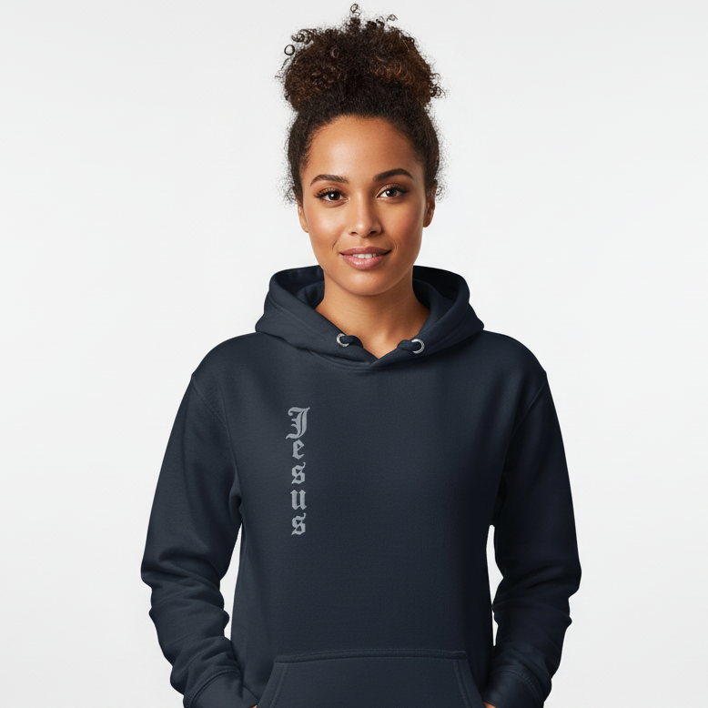 Person wearing a navy hoodie with 'Jesus' printed on it against a white background